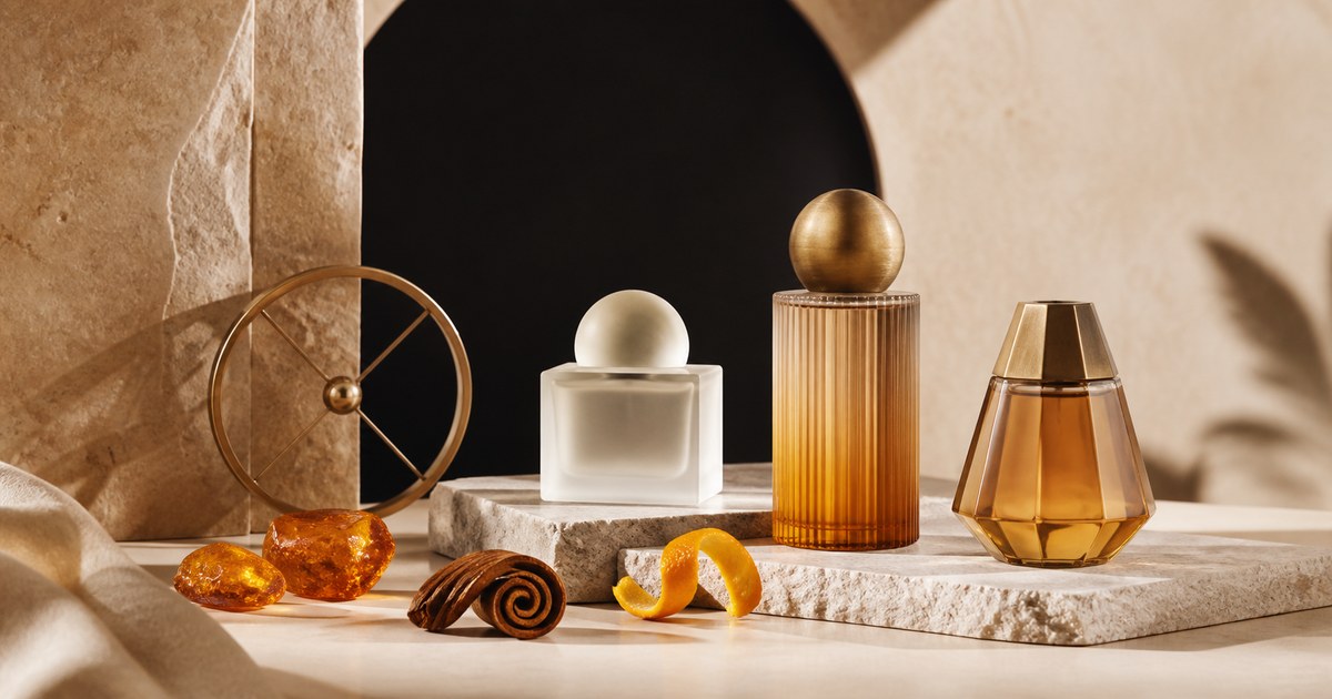Abstract amber fragrance still life with spice, citrus and a compass motif
